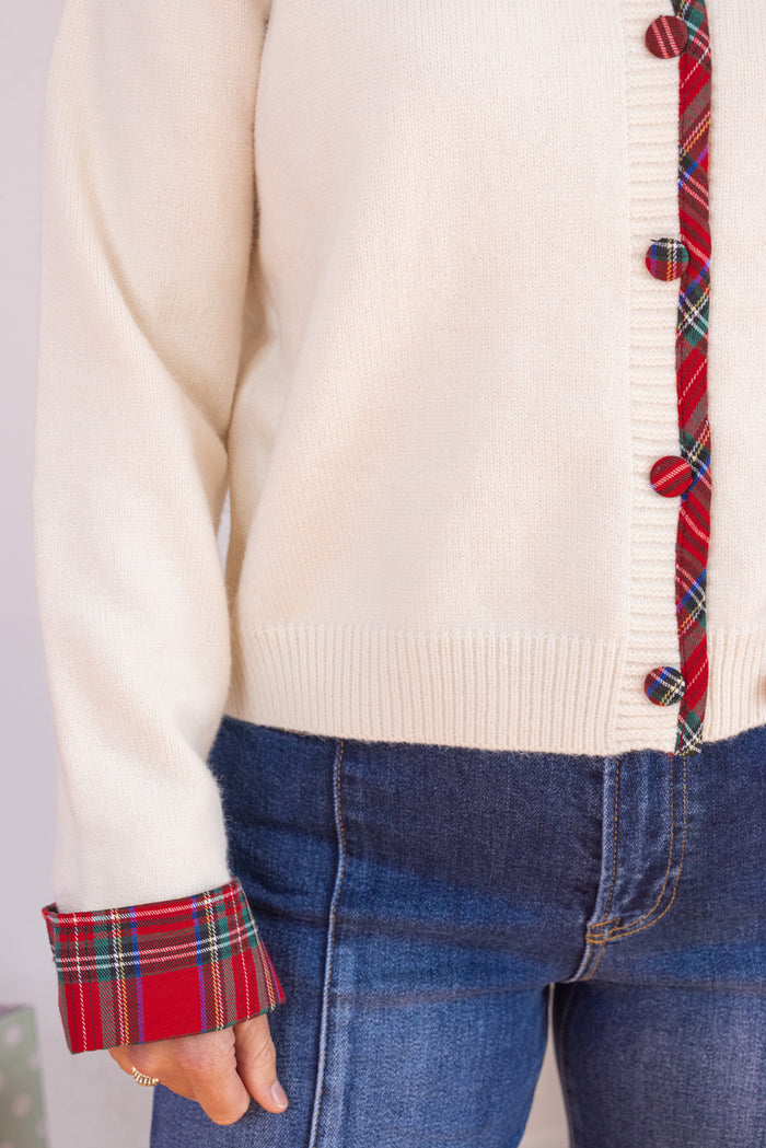 Women's cream button front sweater knit cardigan with contrasting red plaid trim by Entro showing button front closures