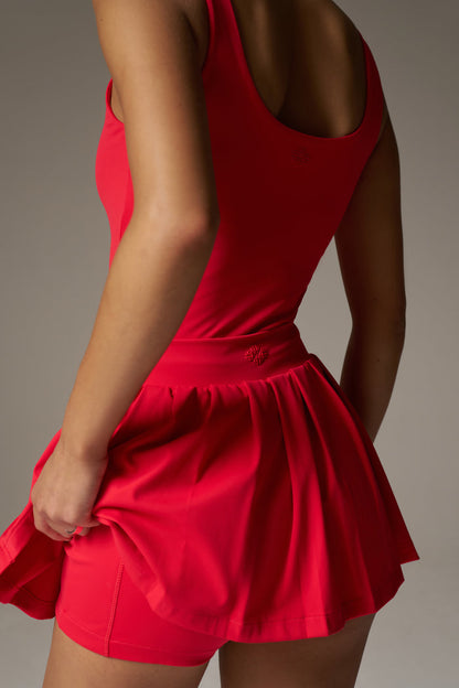 PLEATED SCULPTING STRETCH MINI SKORT - RED