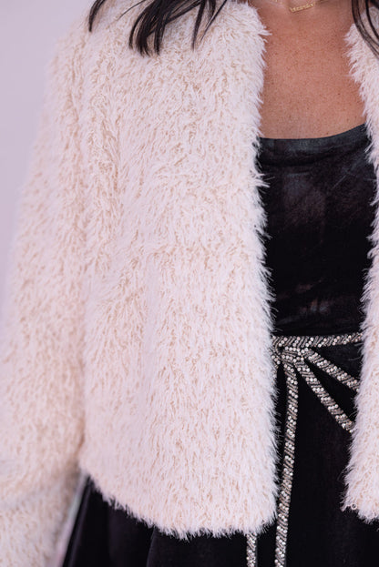 Women's cream faux fur open front cropped jacket by Blu Pepper showing up close view