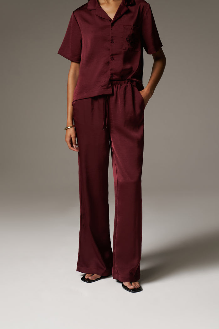 SATIN WIDE LEG EMBLEM TROUSERS - BURGUNDY