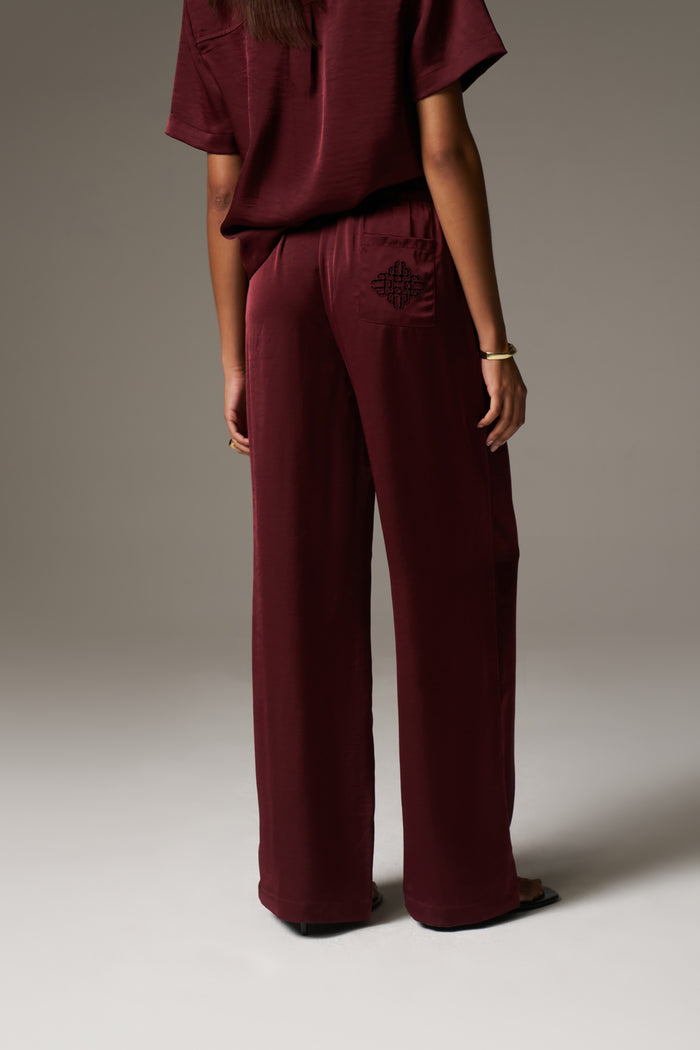 SATIN WIDE LEG EMBLEM TROUSERS - BURGUNDY