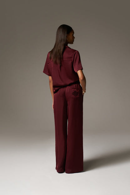 SATIN WIDE LEG EMBLEM TROUSERS - BURGUNDY