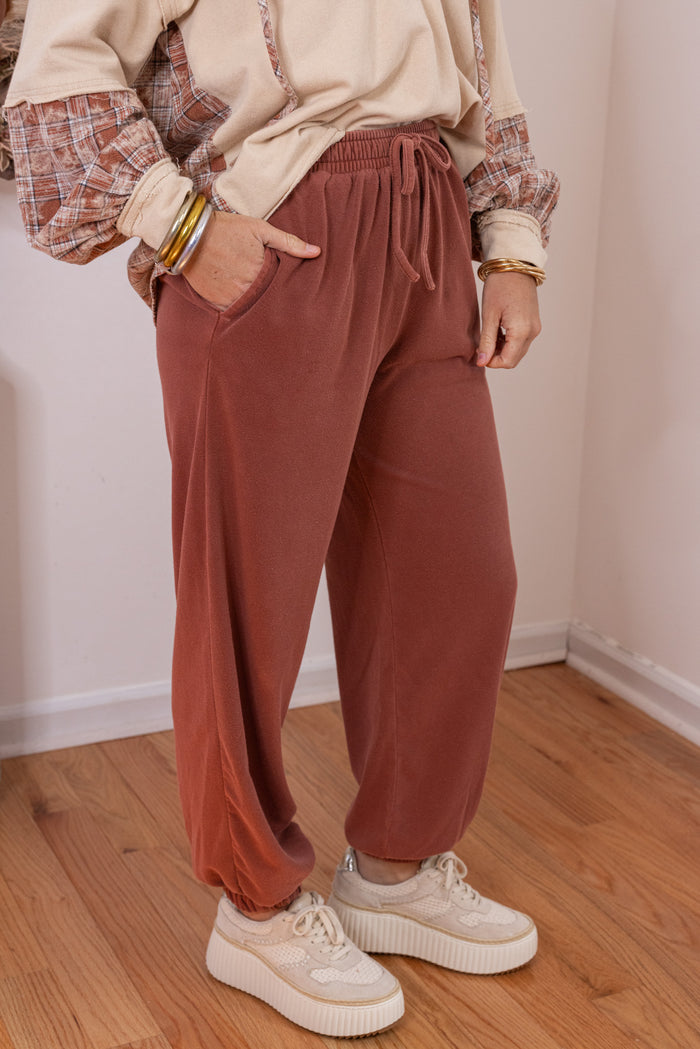 Women's washed terra-cotta terry knit wide leg jogger pants by Blu Pepper showing up close side view