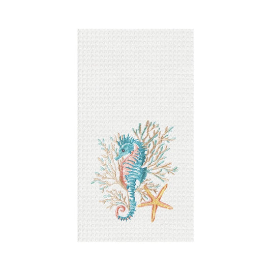 Embroidered design of a seahorse and starfish on a textured white fabric background