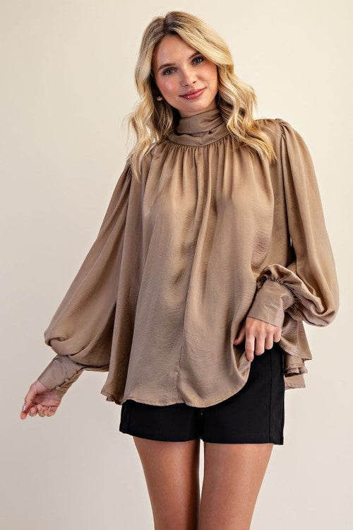 Women's taupe shimmering satin mock neck top with bow tie back