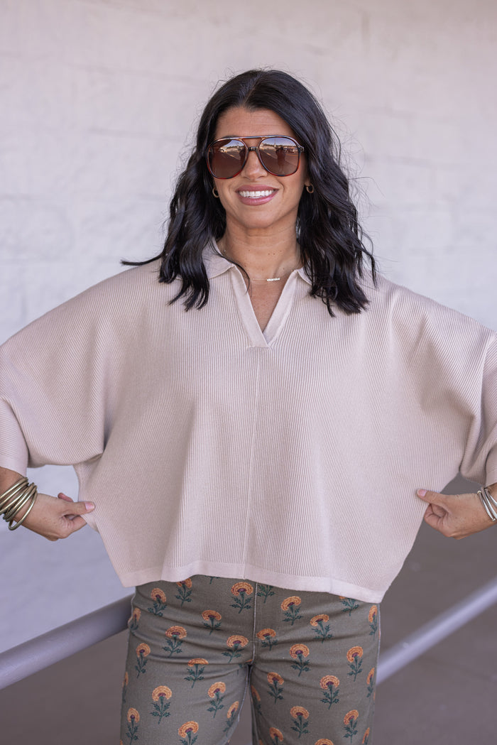 Women's light beige ribbed knit top with a collar by Entro showing boxy, relaxed fit