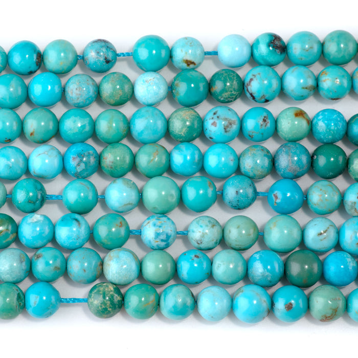 This is a Dakota Stones 7mm Sky Blue Hubei Turquoise Gemstone strand with round beads in 15-16 inch strand.