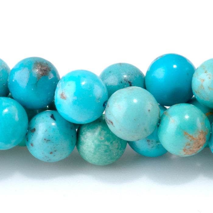 This is a Dakota Stones 7mm Sky Blue Hubei Turquoise Gemstone strand with round beads in 15-16 inch strand.