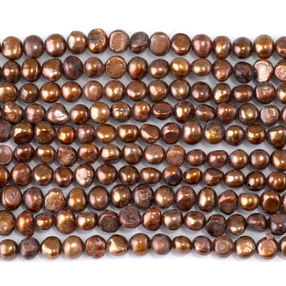 This is a Dakota Stones 5-6mm Special Price Freshwater Pearl Golden Gemstone strand with irregular beads in 15-16 inch strand.