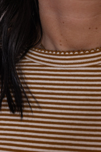 Women's caramel and white striped knit long sleeve top by Wishlist showing crew neckline with scalloped trim