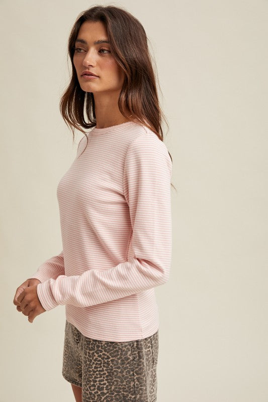 Women's pink and white striped knit long sleeve top by Wishlist showing side view