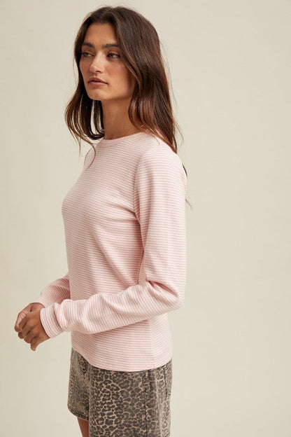Women's pink and white striped knit long sleeve top by Wishlist showing side view