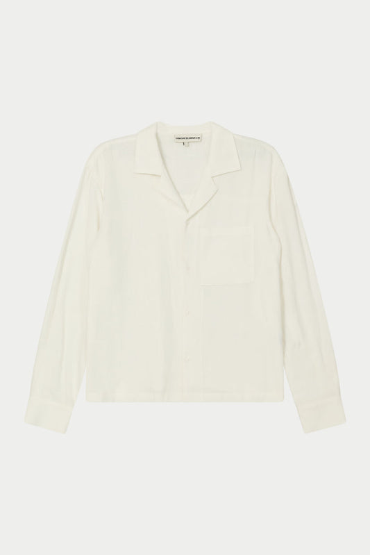 A white, long-sleeved, relaxed fit woven shirt with a revere collar and an oversized chest pocket, displayed on a plain background.