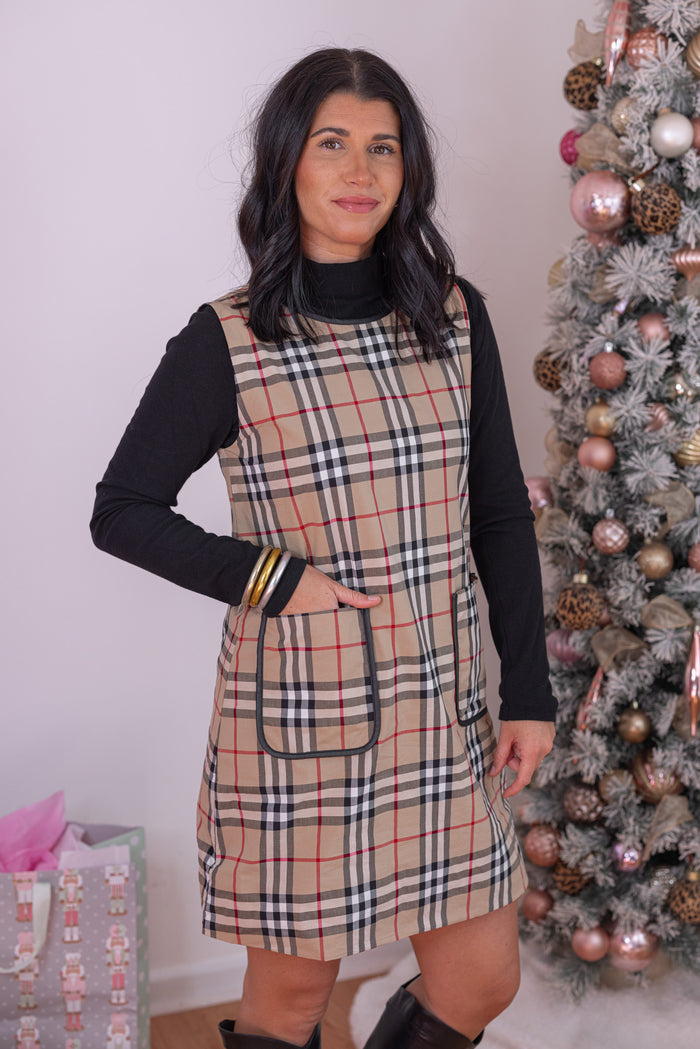 Women's taupe, black and red plaid sleeveless dress with faux leather trim by Jodifl showing up close, front angled view