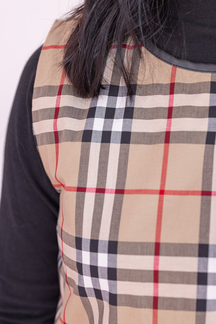 Women's taupe, black and red plaid sleeveless dress with faux leather trim by Jodifl showing up close look at plaid pattern