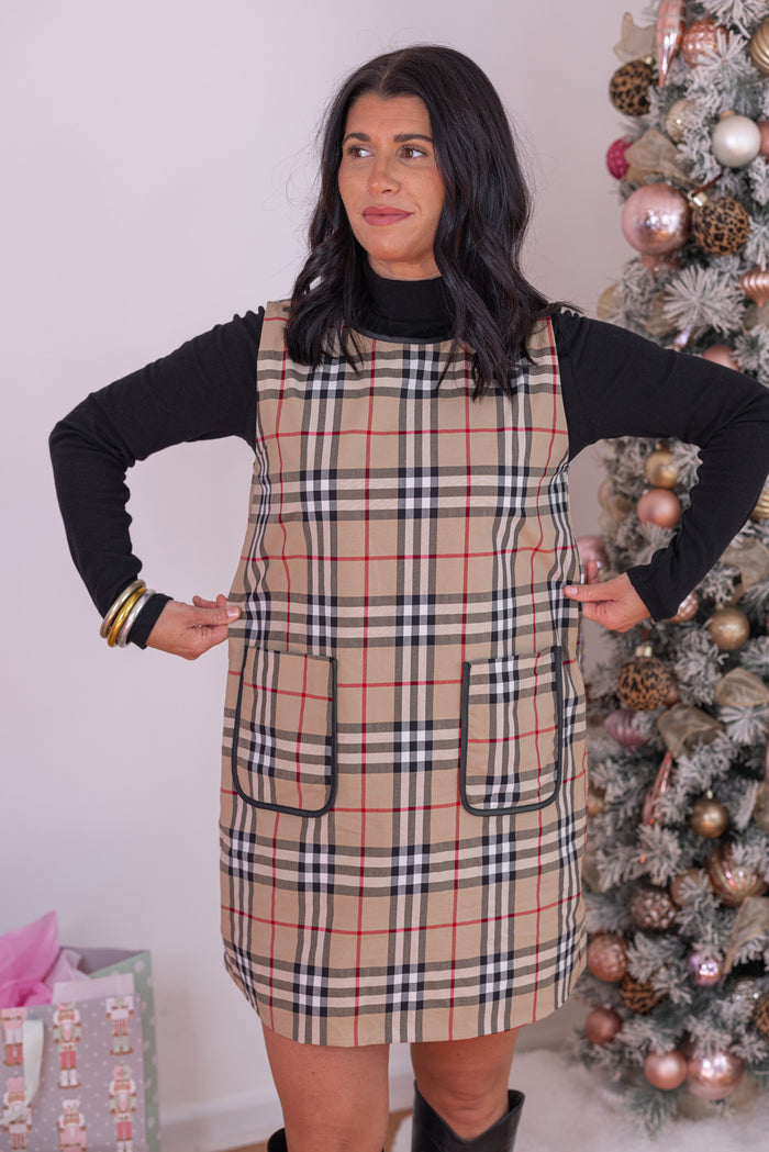 Women's taupe, black and red plaid sleeveless dress with faux leather trim by Jodifl showing true to size fit