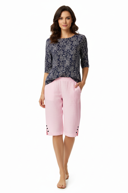 Front view of women's linen shorts showing the adjustable drawstring waist, loose leg shape and practical side pocket details